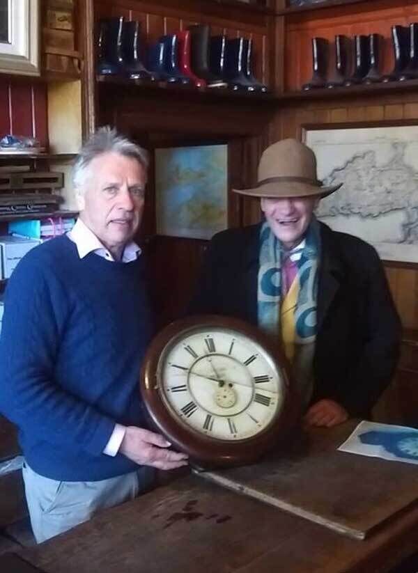 Owner Oliver MacDonnell and his brother Ron with the returned clock