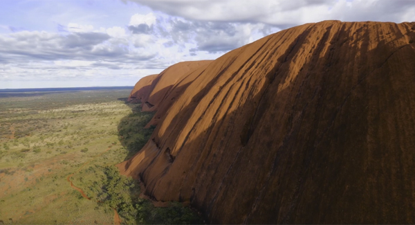 This drone footage provides a stunning perspective of Uluru