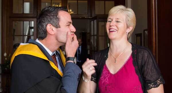 Thomas had a chance to catch up with family and friends before the ceremony and shared a laugh with coach Hayley Harrison. Picture: Alan Place