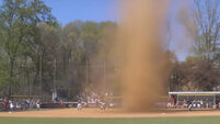 Watch the moment a whirlwind threw a softball game into turmoil