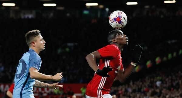 Manchester United's Paul Pogba in action with Manchester City's Pablo Maffeo. Photo: Martin Rickett/PA