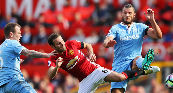 Juan Mata takes time out to greet disabled Man Utd fan