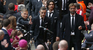 Manager Jurgen Klopp (right) and Jordan Henderson lead the players and staff as they arrive at Anfield. Manager Jurgen Klopp (right) and Jordan Henderson lead the players and staff as they arrive at Anfield.