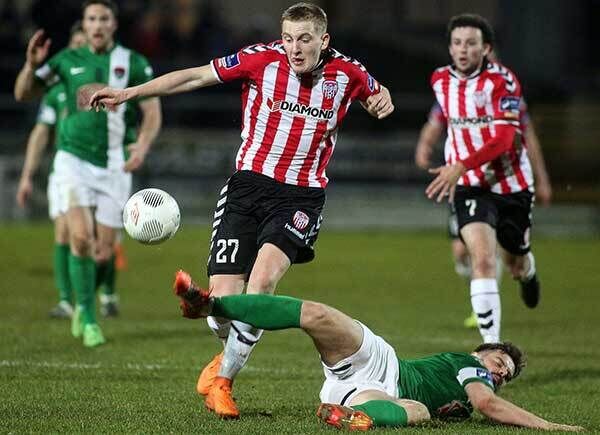 Derry goalscorer Ronan Curtis is tackled by Cork City's Greg Bolger at the Brandywell. Photo: INPHO/Presseye/Lorcan Doherty