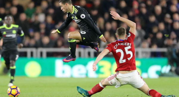 Chelsea's Eden Hazard and Middlesbrough's Calum Chambers battle for the ball at The Riverside Stadium. Photo: Owen Humphreys/PA Chelsea's Eden Hazard and Middlesbrough's Calum Chambers battle for the ball at The Riverside Stadium. Photo: Owen Humphreys/PA