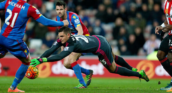 Sunderland goalkeeper Vito Mannone pounces on the ball at the Stadium of Light. Photo: Owen Humphreys/PA