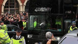 Watch West Ham fans throw bottles at Man United team bus, delaying kick off
