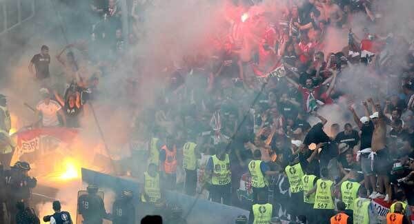 Hungary fans lighting flares at yesterday's game against Iceland. Pic: PA Hungary fans lighting flares at yesterday's game against Iceland. Pic: PA
