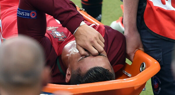 Cristiano Ronaldo is carried off on a stretcher during the UEFA Euro 2016 Final at the Stade de France. Photo: Joe Giddens/PA