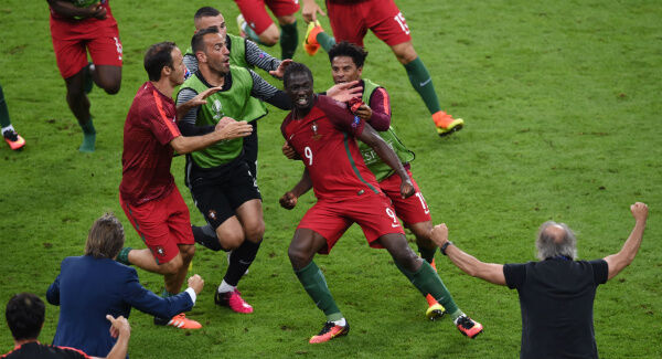 Portugal players celebrate after Eder (centre) scores the winning goal. Photo: Joe Giddens/PA