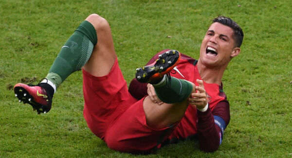 Cristiano Ronaldo lies injured during the UEFA Euro 2016 Final at the Stade de France. Photo: Joe Giddens/PA