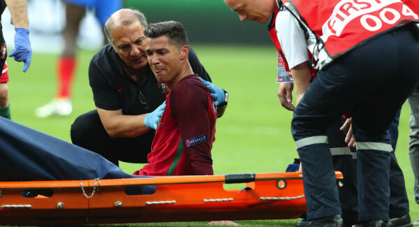 Cristiano Ronaldo cries on the pitch during the Euro 2016 final. AP Photo/Thanassis Stavrakis