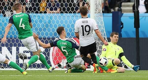 Northern Ireland's Michael McGovern blocks from Germany's Mario Gotze. Pic: INPHO/Presseye/William Cherry.