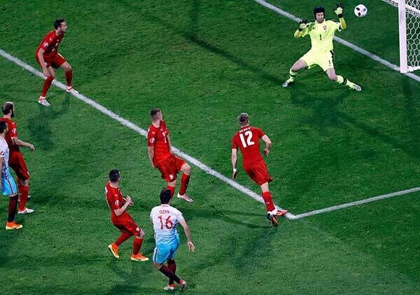 Turkey's Ozan Tufan scores his side's second goal at the Bollaert stadium in Lens. AP Photo/Darko Vojinovic