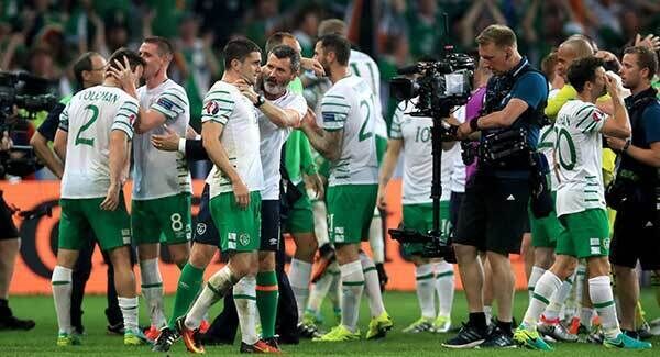 Robbie Brady is congratulated by assistant manager Roy Keane on the pitch at the Stade Pierre Mauroy. Photo: John Walton/PA Robbie Brady is congratulated by assistant manager Roy Keane on the pitch at the Stade Pierre Mauroy. Photo: John Walton/PA