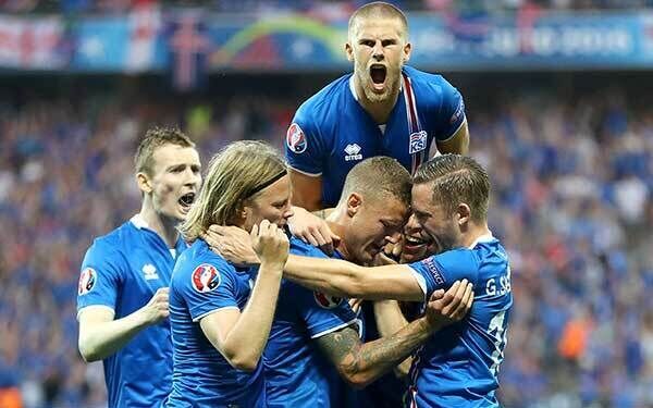 Iceland's Ragnar Sigurdsson (centre) celebrates with his team-mates after scoring his side's first goal at Stade de Nice. Photo: Owen Humphreys/PA
