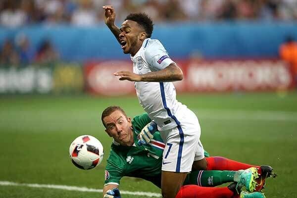 England's Raheem Sterling is fouled by Iceland's Birkir Mar Saevarsson to win his side a penalty. Photo: Nick Potts/PA