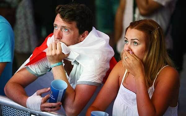England fans react in the fan zone in Nice. Photo: Brian Lawless/PA