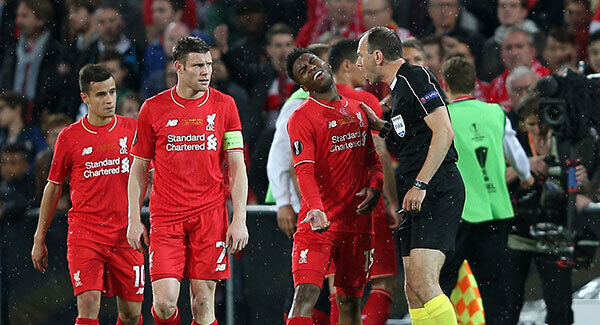 Referee Jonas Erikssen dismisses protests from Liverpool players as Sevilla's Andujar Coke (not pictured) scores his sides third goal. Photo: David Davies/PA