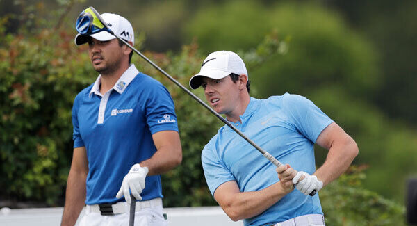 Rory McIlroy watches his tee shot as Jason Day watches on the sixth hole during the semi-final at the Dell Match Play Championship at Austin County Club. Photo: AP / Eric Gay