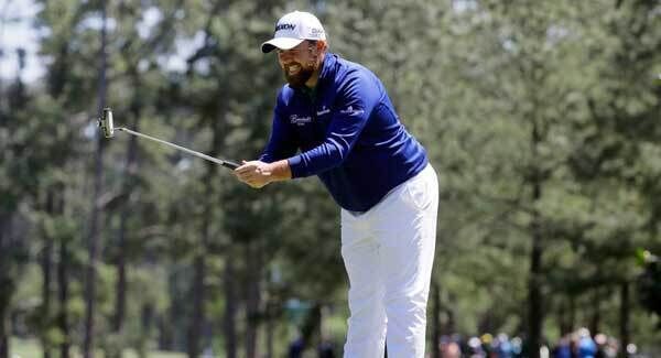 Shane Lowry reacts to a putt on the first green. Pic: PA Shane Lowry reacts to a putt on the first green. Pic: PA