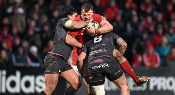 Robin Copeland is tackled by Josh Matavesi, left, and Dan Baker. Photo: Stephen McCarthy / SPORTSFILE