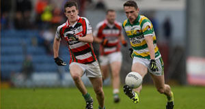 Rosscarbery's John O'Rourke bursts past Ballincollig's Shane Murphy. Pic: Sportsfile.