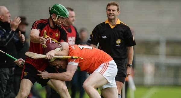 Fintan Conway of Down tussles with Eoin McGuinness of Armagh at the Athletic Grounds. Photo by Piaras Ó Mídheach/Sportsfile