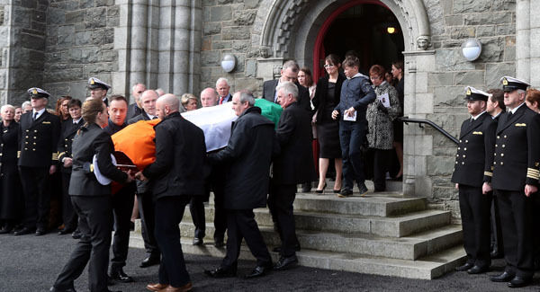 The coffin of Captain Mark Duffy is carried from St Oliver Plunkett Church in Blackrock, after he died when the Irish Coast Guard helicopter he was in crashed off the coast of Co Mayo.