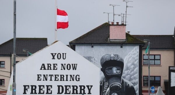 A Derry GAA flag flies at half mast at the 'Free Derry' wall in the Bogside after the death of Martin McGuinness aged 66. Pic: PA