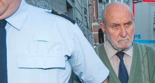 Leo Hickey is led from the courthouse in Cork.