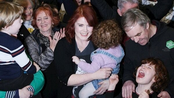 Neasa Hourigan celebrates with her family after being elected as a Green Party TD in Dublin Central. The party’s finance spokesperson made it clear that the Greens’ inclusion in a coalition Government cannot be taken for granted, as many appear to be doing. Picture: Niall Carson/PA Wire