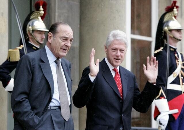 Jacques Chirac with former US president Bill Clinton in 2005 (Jacques Brinon/AP)