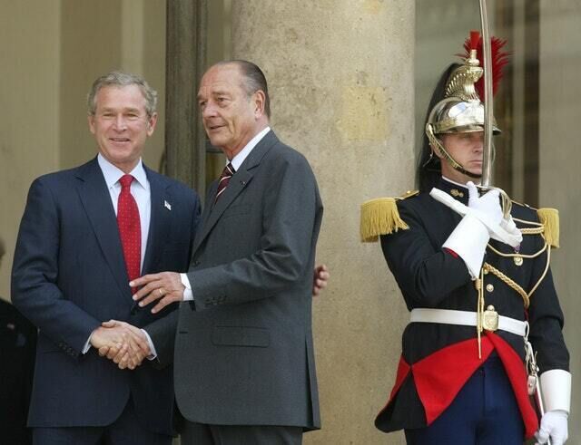 George W Bush with Jacques Chirac in 2004 (Charles Dharapak/AP)