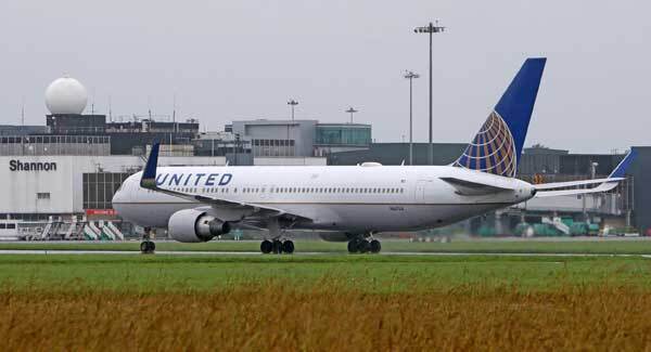 Man dragged off plane lost teeth and suffered concussion, lawyer says