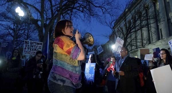 Activists and protesters with the National Center for Transgender Equality rally in front of the White House yesterday. Pic: AP