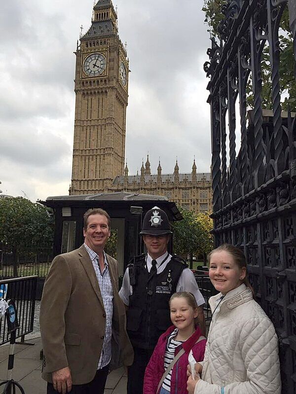 Australian Andrew Thorogood, 41, and daughters Alexsandra, 12, and Georgia, 9, with PC Keith Palmer in October 2016. Pic: Andrew Thorogood/PA Wire