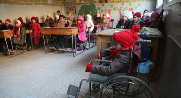 Children going back to school in east Ghouta, Syria, including Maysam, 10, (right) who suffers from a birth spine defect, as more children were killed in the Syrian conflict in 2016 than in any previous year of the war since records began, Unicef figures show.