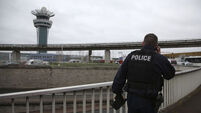 Latest: Man shot dead in Paris airport after grabbing a gun from anti-terror officer