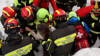Mother and son pulled alive from Italian avalanche debris; 8 more survivors found