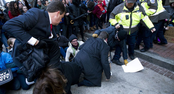 Inaugural attendees move through demonstrators attempting to block people entering a security checkpoint. Picture: AP