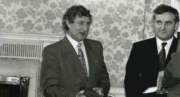Progressive Democrats TD Bobby Molloy receives his seal of office while Fianna Fail TD Bertie Ahern looks on(R). 11/2/1992. Progressive Democrats TD Bobby Molloy receives his seal of office while Fianna Fail TD Bertie Ahern looks on(R). 11/2/1992.