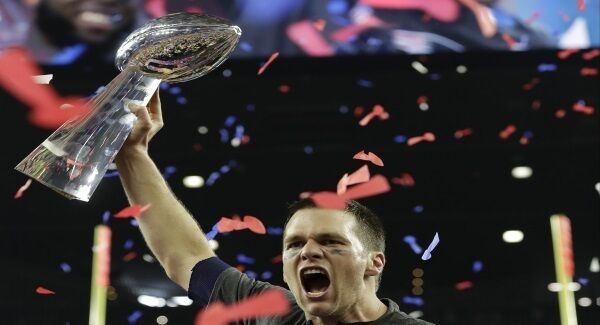 Tom Brady raises the Vince Lombardi Trophy. Pic: AP