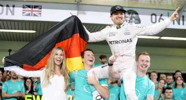 Nico Rosberg celebrates winning the World Championship with his wife Vivian after the Abu Dhabi Grand Prix.