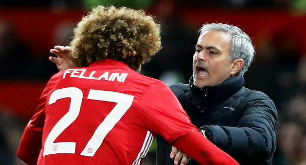 Manchester United's Marouane Fellaini celebrates scoring his side's second goal of the game with manager Jose Mourinho at Old Trafford. Photo: Martin Rickett/PA