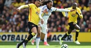 Watford's Etienne Capoue (left) and Sunderland's Jason Denayer battle for the ball during the Premier League match at Vicarage Road, Watford.