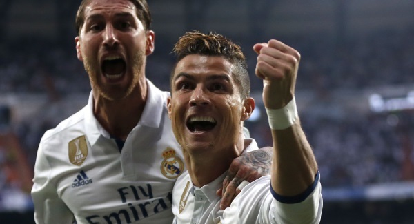 Ronaldo hat-trick all but knocks Atletico out