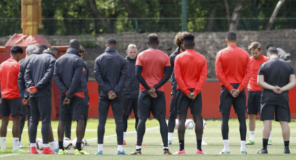 Manchester United's Wayne Rooney stands alongside teammates for a minute’s silence in memory of the victims of the Manchester terror attack. Photo: Martin Rickett/PA Manchester United's Wayne Rooney stands alongside teammates for a minute’s silence in memory of the victims of the Manchester terror attack. Photo: Martin Rickett/PA
