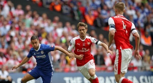 Chelsea's Eden Hazard, Arsenal'sNacho Monreal, and Per Mertesacker battle for the ball during the Emirates FA Cup Final. Chelsea's Eden Hazard, Arsenal'sNacho Monreal, and Per Mertesacker battle for the ball during the Emirates FA Cup Final.