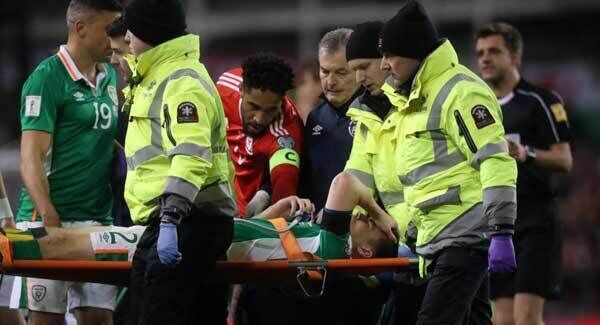 Coleman is consoled by Everton teammate Ashley Williams. Coleman is consoled by Everton teammate Ashley Williams.